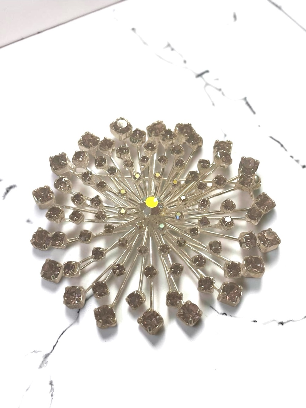 Sparkling Silver-tone Starburst Brooch with Amethyst Stones